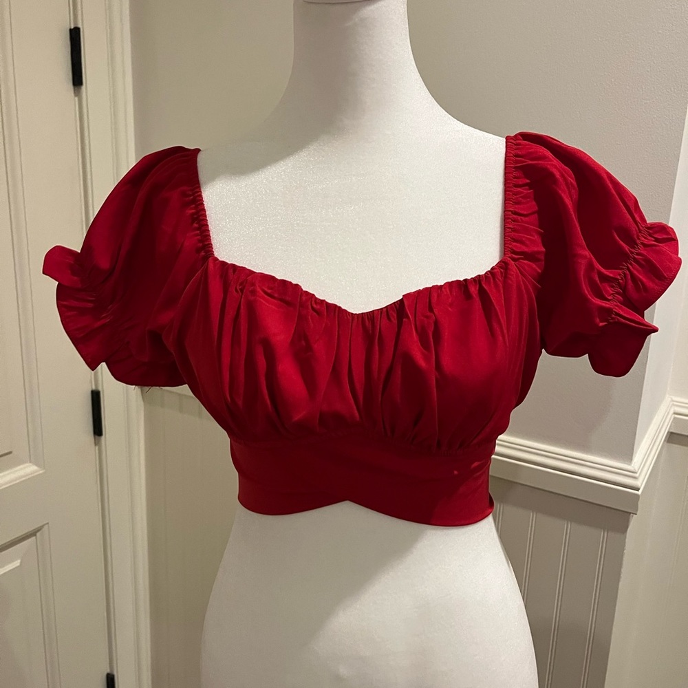 Red cropped blouse.